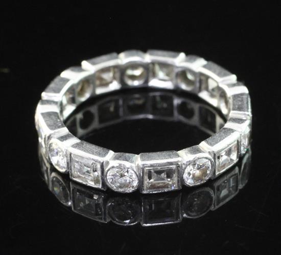 A 20th century platinum and diamond full eternity ring, size M.
